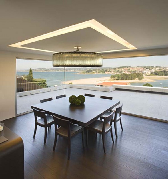 Modern Glass House Design in Cliff Side of Galicia Spain - Wooden Dining Table