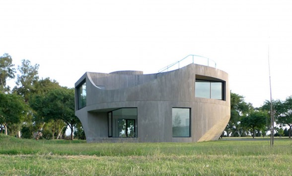 Unique Shape of a Concrete House with Modern Interior Design in Argentina