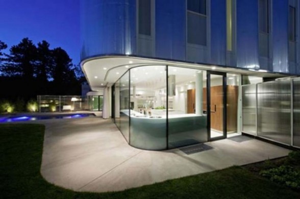Curved House Design with Modern Architecture from Caramel Architect - Glass Entrance Door