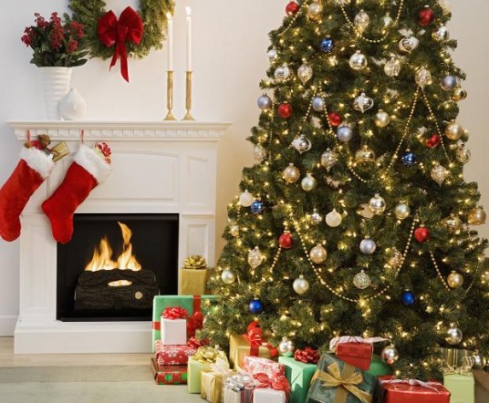 Christmas tree with presents and fireplace with stockings